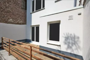 Façade de la maison de notre client après les travaux d'isolation thermique par l'extérieur (ITE)